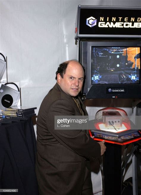 Jason Alexander plays video games at the Nintendo booth at the .